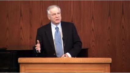 man standing at podium speaking at DTS Chapel