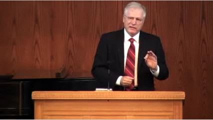 man standing at podium speaking at DTS Chapel