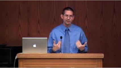 man standing at podium speaking at DTS Chapel
