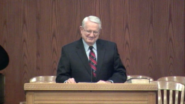 Dr. Chuck Swindoll standing at podium speaking at DTS Chapel