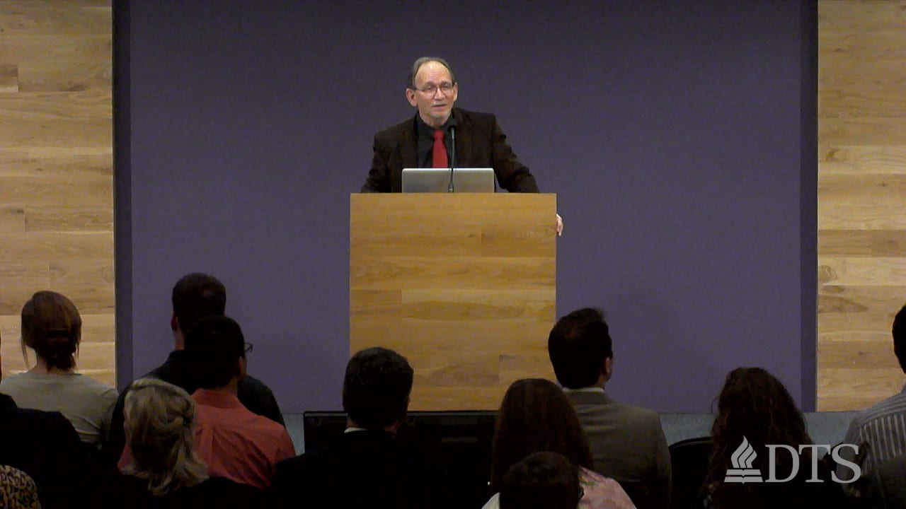 Dr. Scott Horrell standing at podium speaking at DTS Chapel