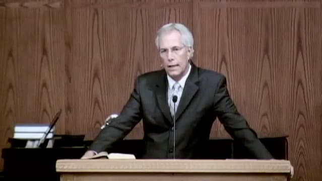 man standing at podium speaking at DTS Chapel