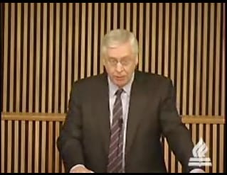 man standing at podium speaking at DTS Chapel