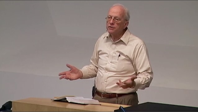 man standing at podium speaking at DTS Chapel