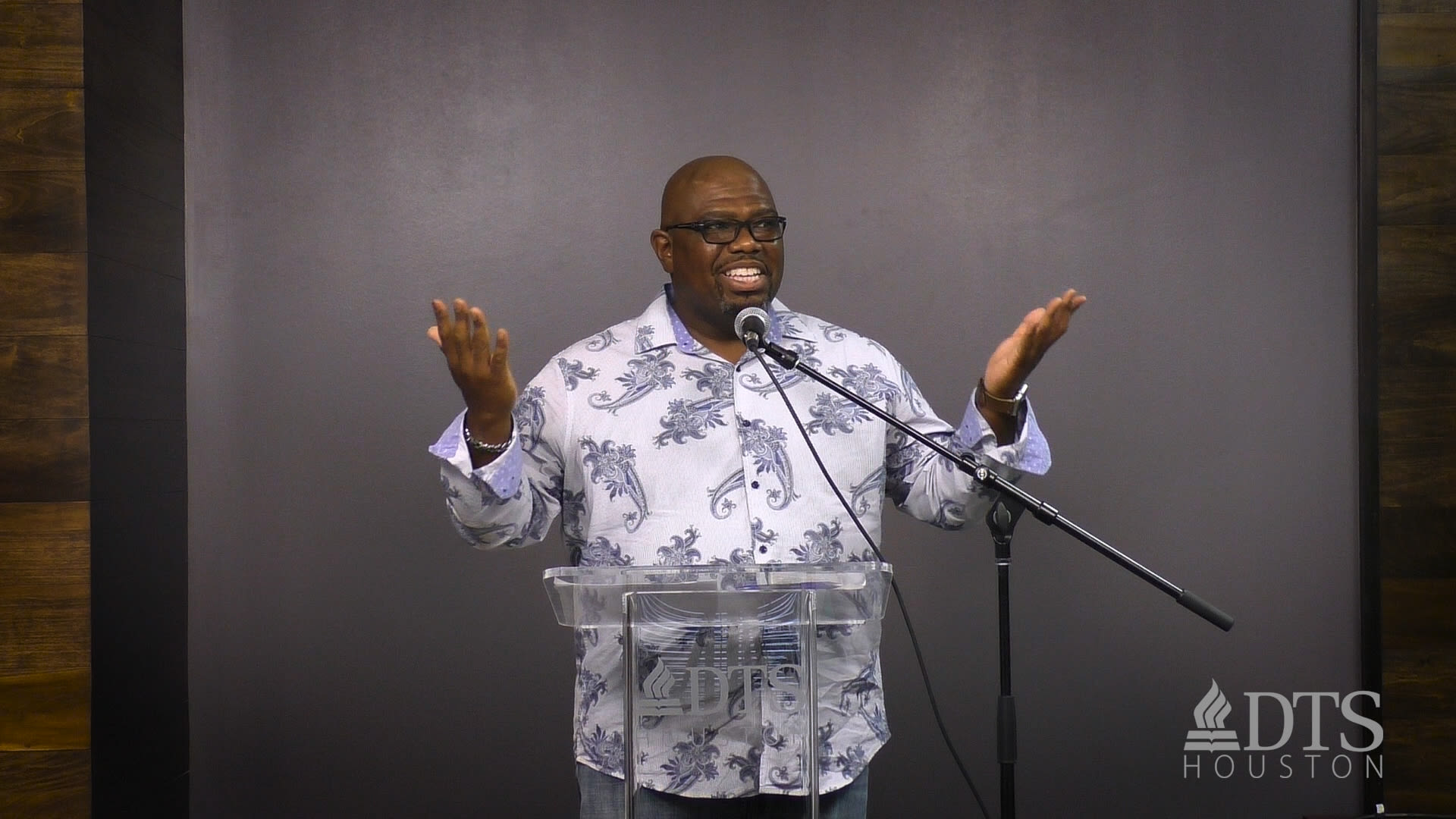 man standing at podium speaking at DTS Chapel