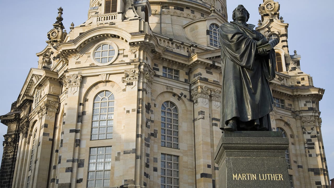 Monument of Martin Luther holding Bible standing in Newmarkt Square, Dresden