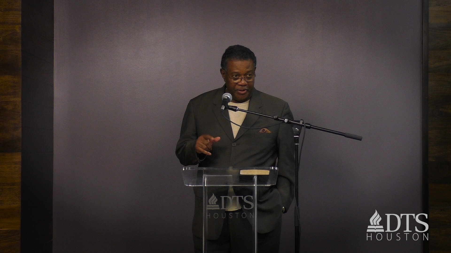 man standing at podium speaking at DTS Chapel