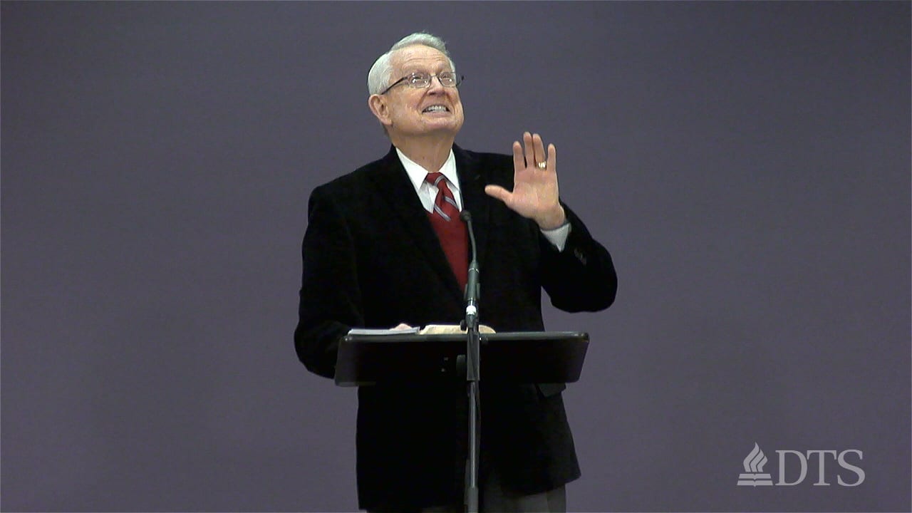 Dr. Chuck Swindoll standing at podium speaking at DTS Chapel