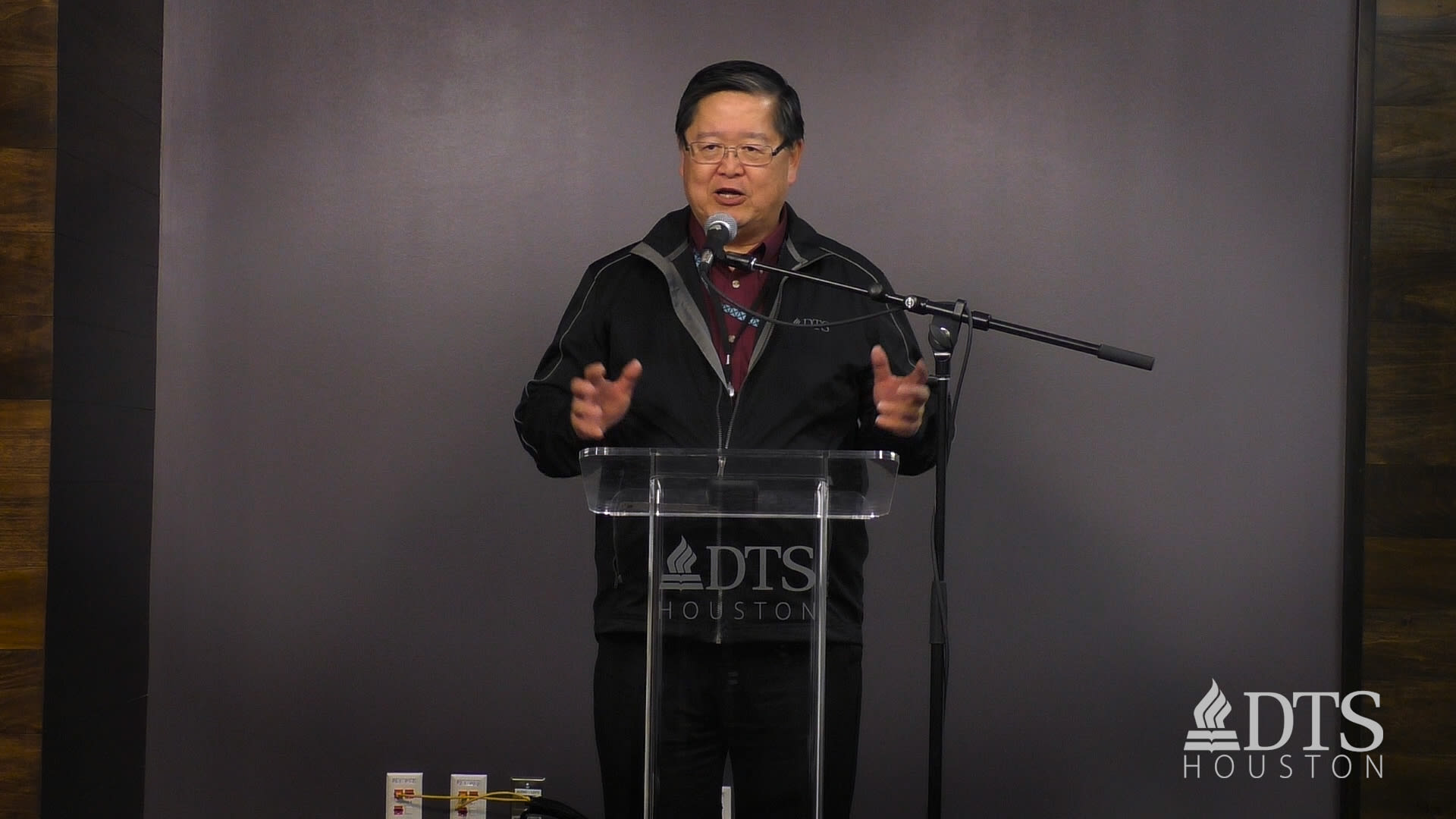 man standing at podium speaking at DTS Chapel