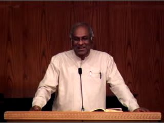 man standing at podium speaking at DTS Chapel
