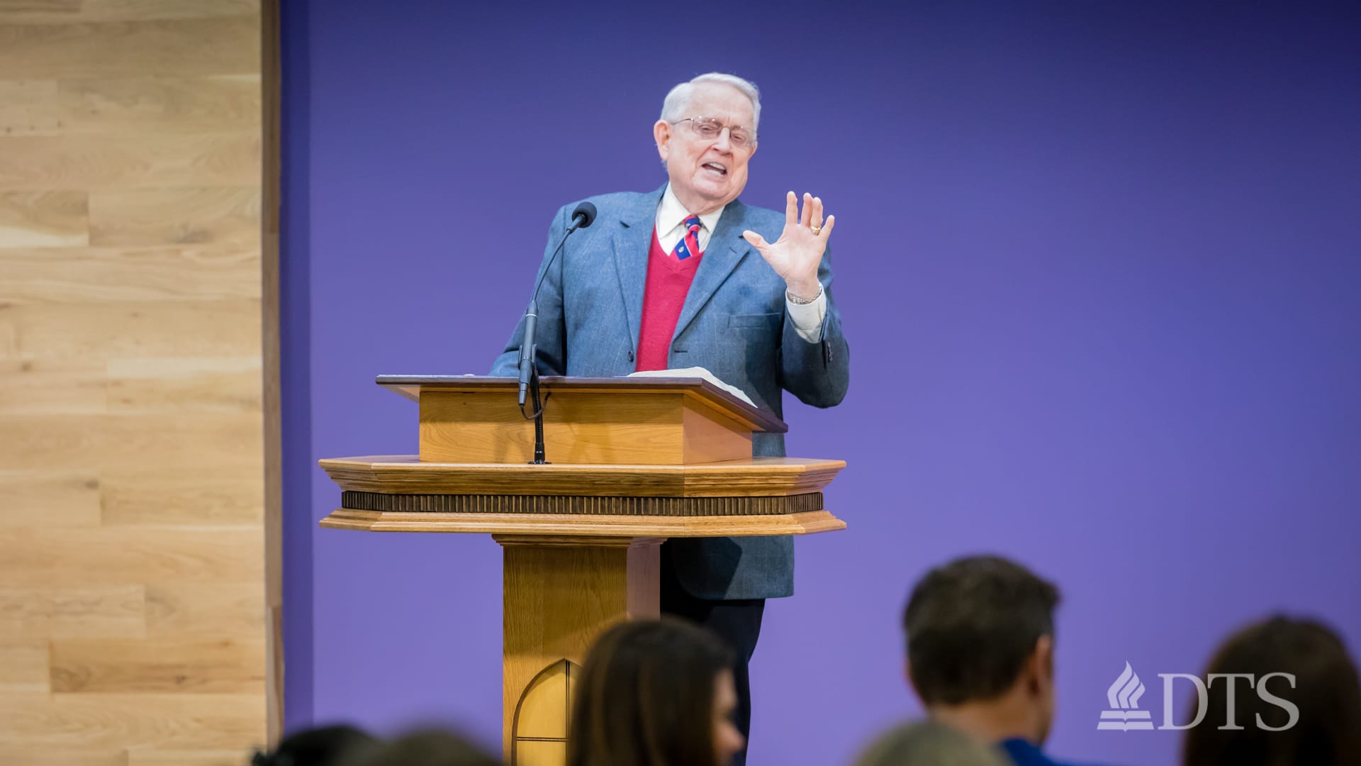 Dr. Chuck Swindoll standing at podium speaking at DTS Chapel