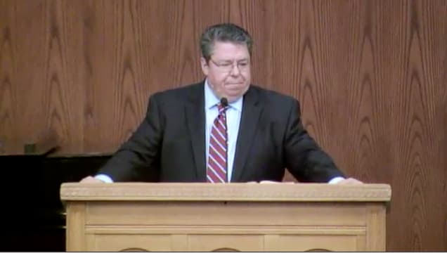 Dr. Mark Bailey standing at podium speaking at DTS Chapel