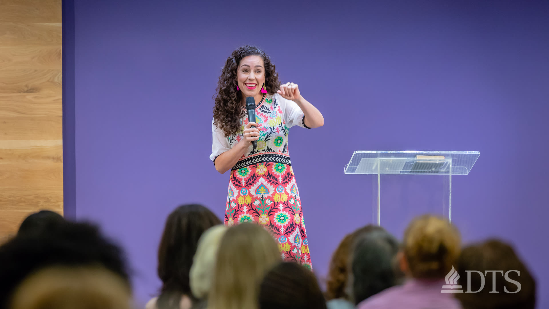 Kat Armstrong standing near podium while speaking at DTS Chapel