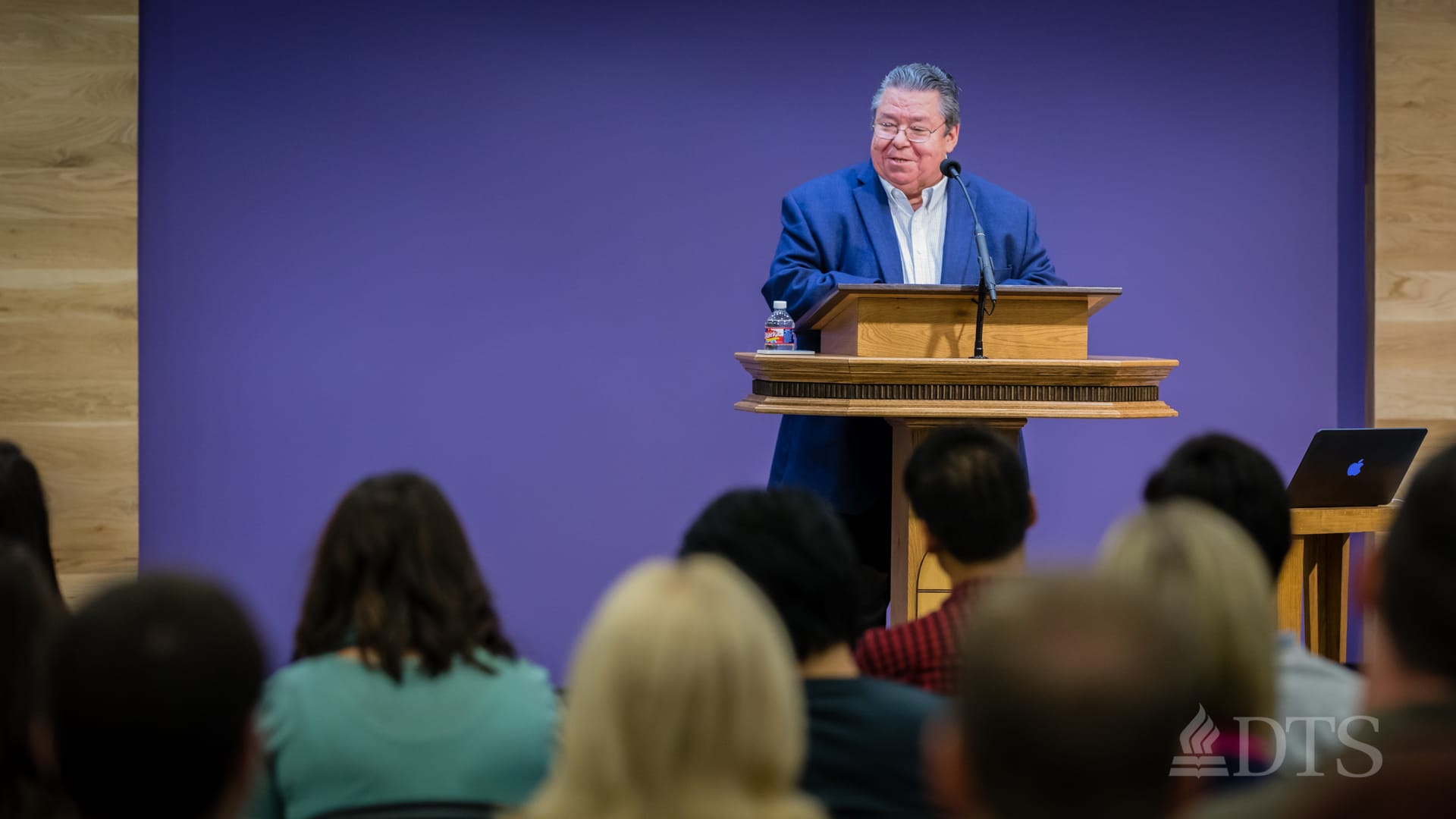 Dr. Mark Bailey standing at podium speaking at DTS Chapel