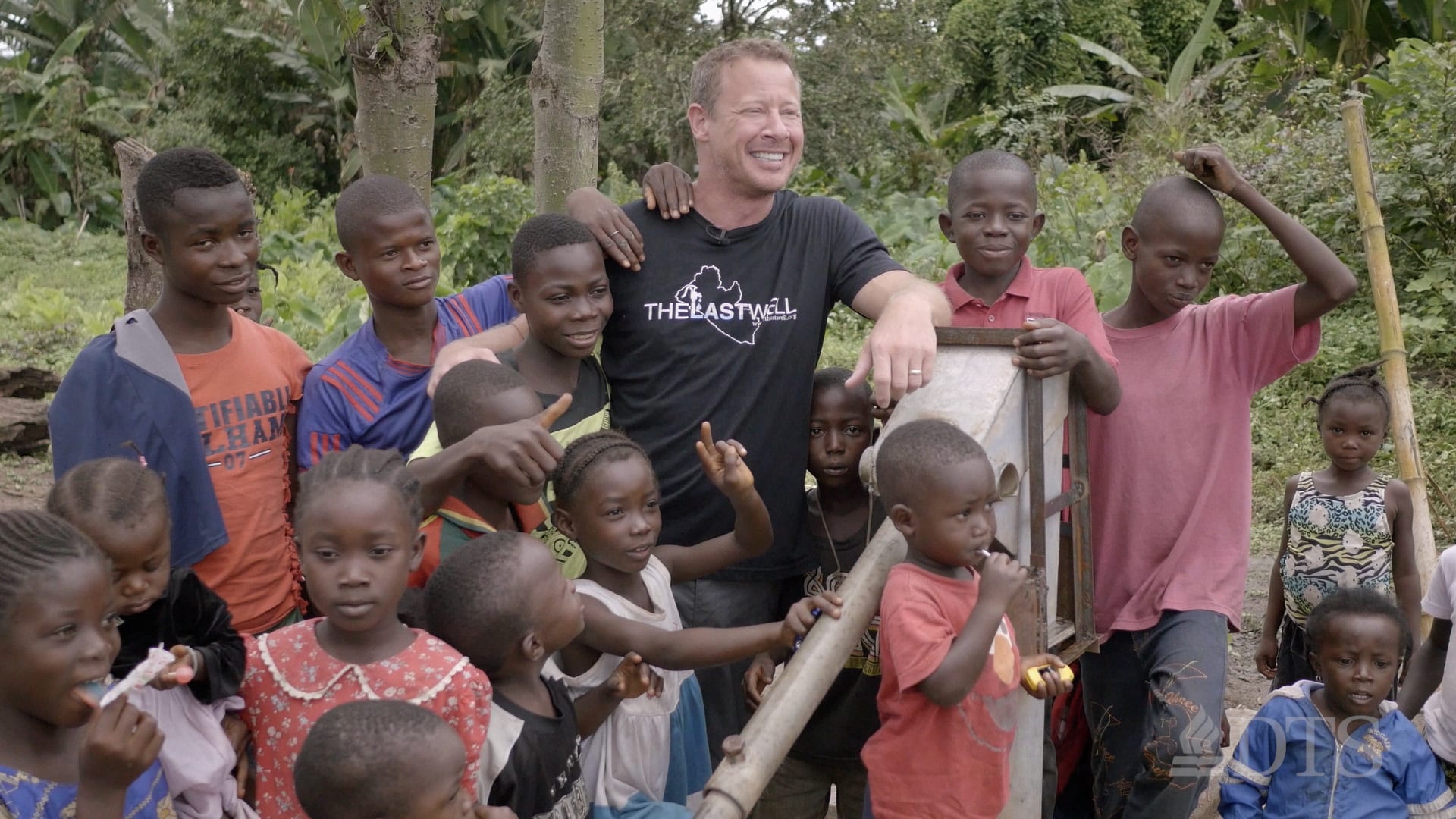 Dr. Todd Phillips with Liberian children at a well