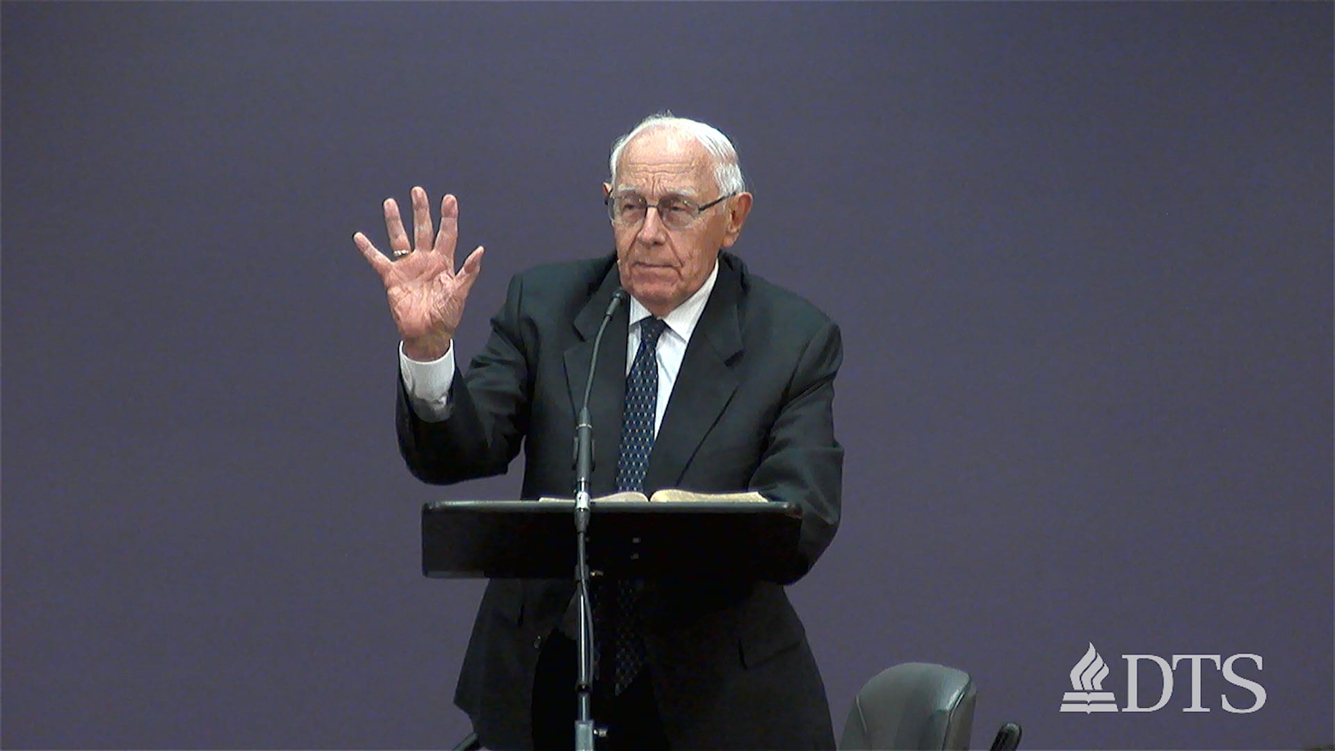 man standing at podium speaking at DTS Chapel
