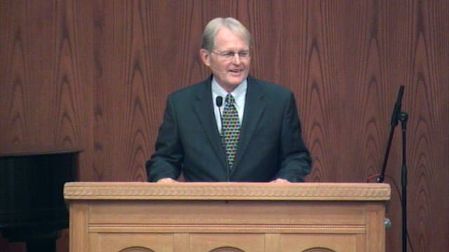 man standing at podium speaking at DTS Chapel