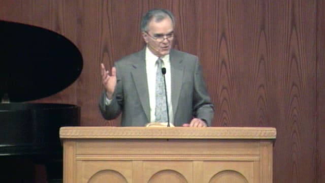 man standing at podium speaking at DTS Chapel
