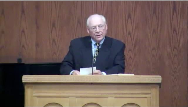 man standing at podium speaking at DTS Chapel