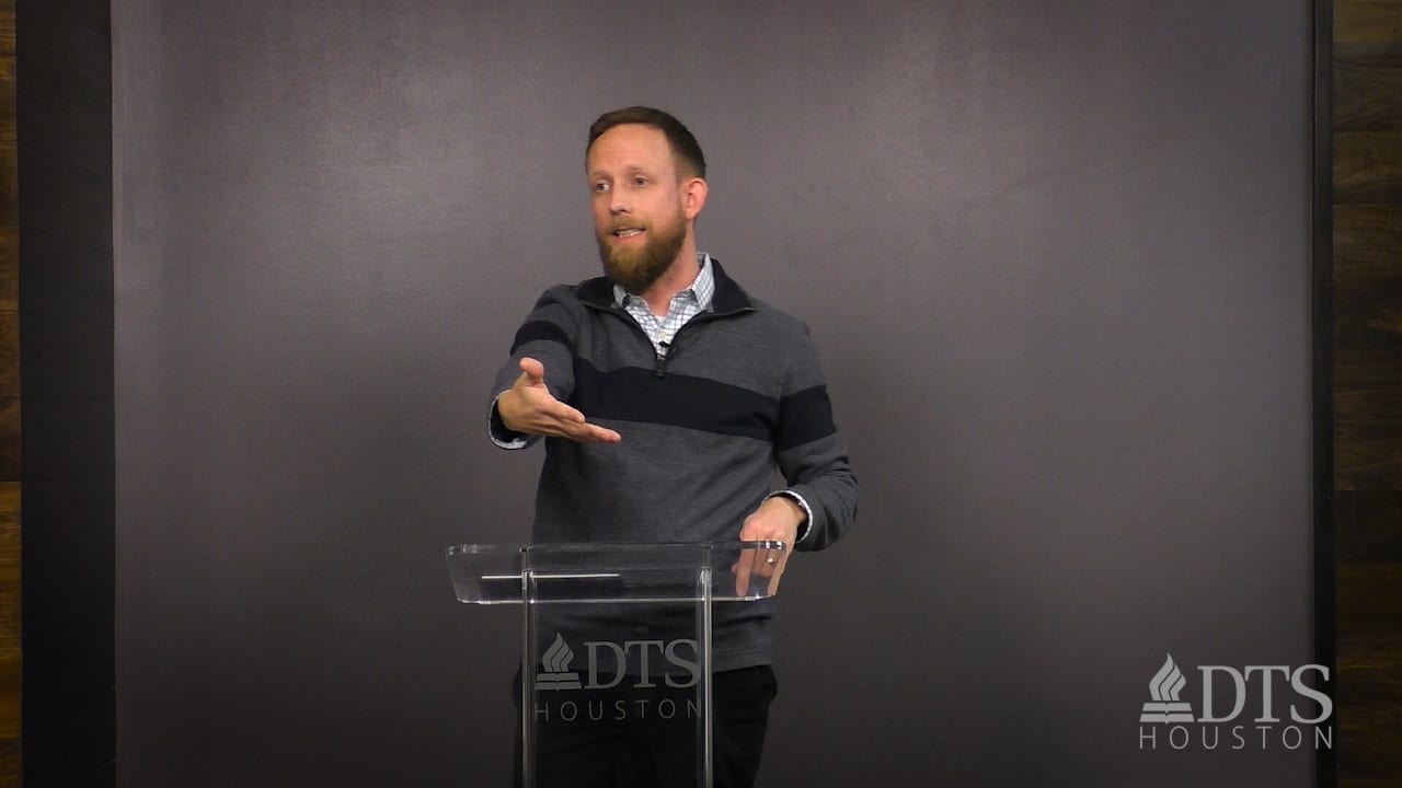 man standing at podium speaking at DTS Chapel