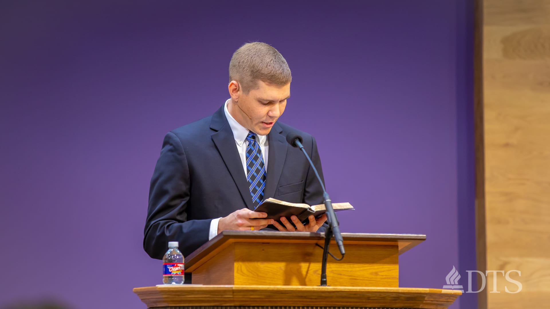 man standing at podium speaking at DTS Chapel