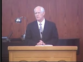 man standing at podium speaking at DTS Chapel