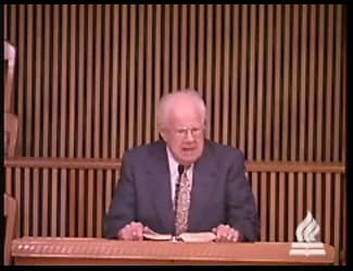 man standing at podium speaking at DTS Chapel