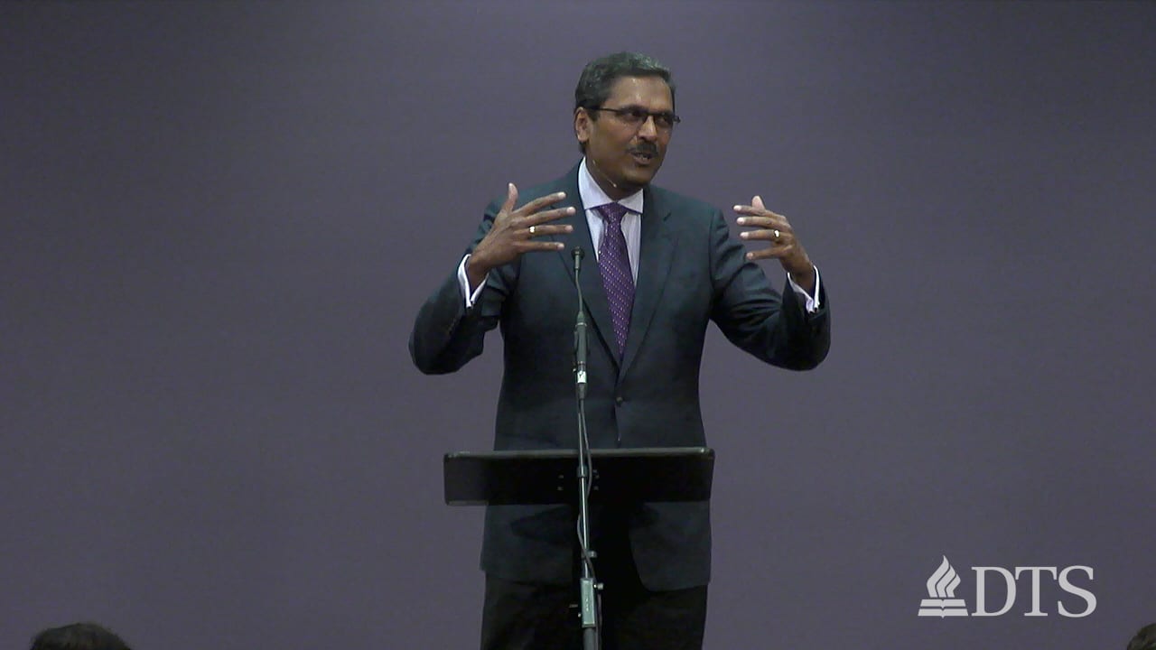 man standing at podium speaking at DTS Chapel