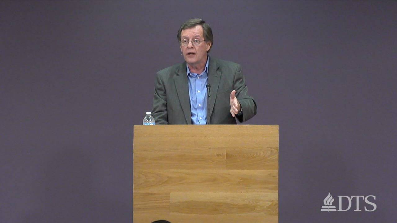 man standing at podium speaking at DTS Chapel