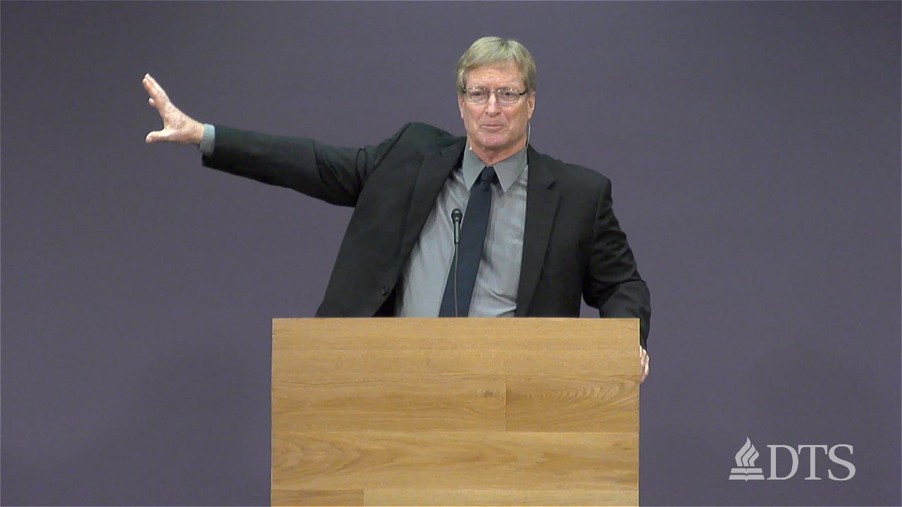 man standing at podium speaking at DTS Chapel