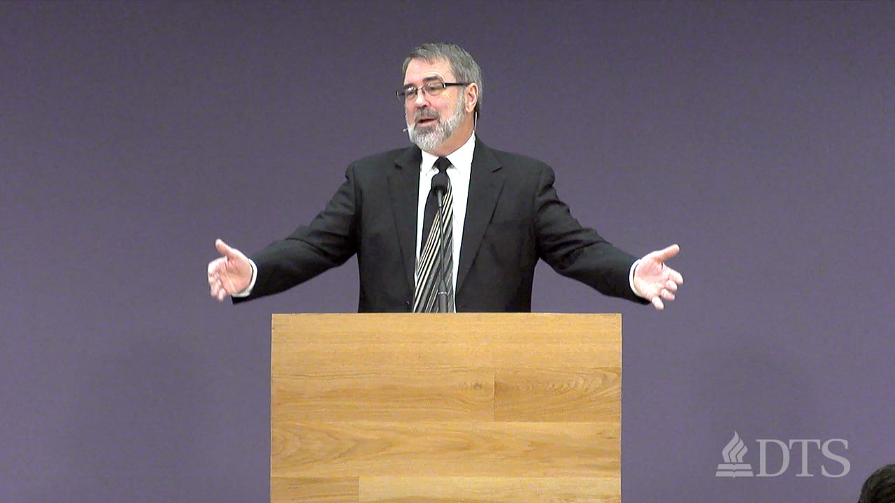 man standing at podium speaking at DTS Chapel