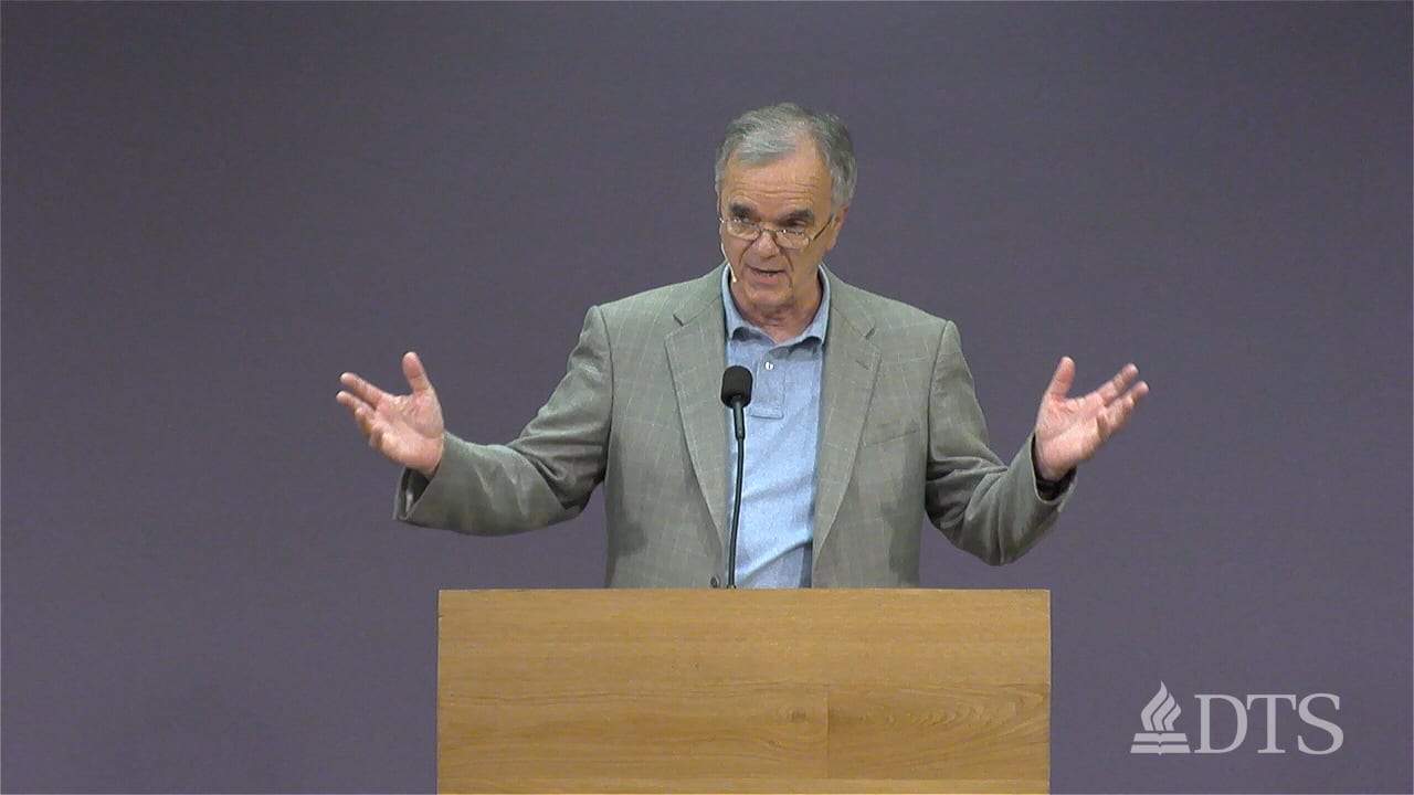 man standing at podium speaking at DTS Chapel