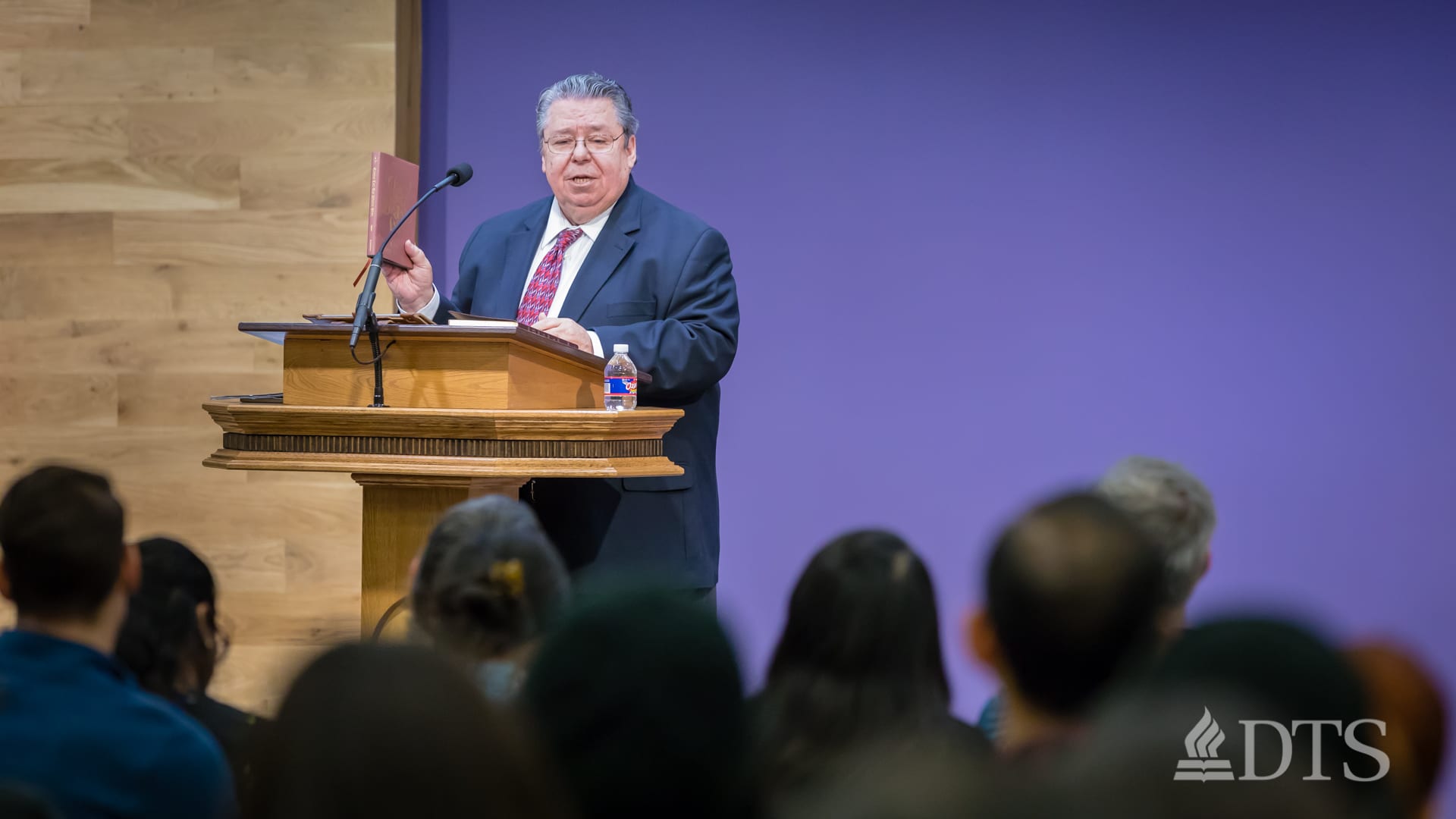 Dr. Mark Bailey standing at podium speaking at DTS Chapel