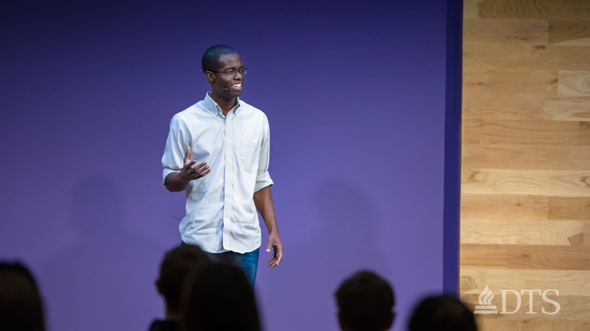man standing on stage while speaking at DTS Chapel
