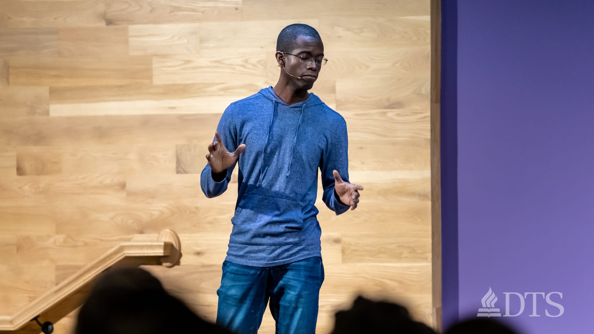 man standing on stage while speaking at DTS Chapel