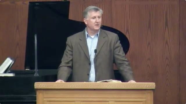 man standing at podium speaking at DTS Chapel