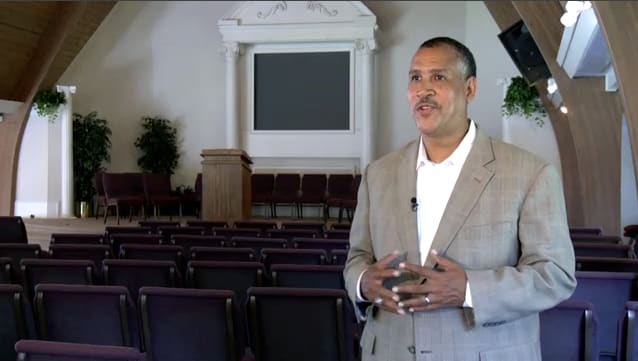DTS alum Robert Crummie standing at the back of an empty church