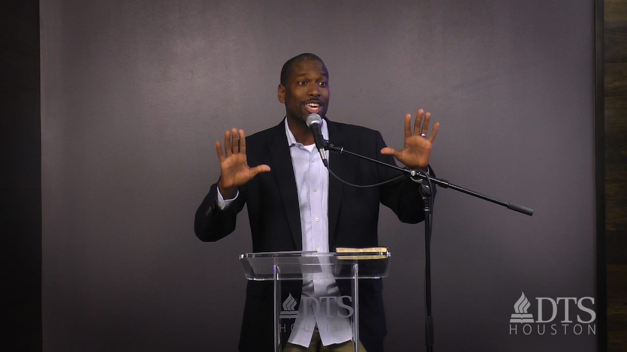 man standing at podium speaking at DTS Chapel