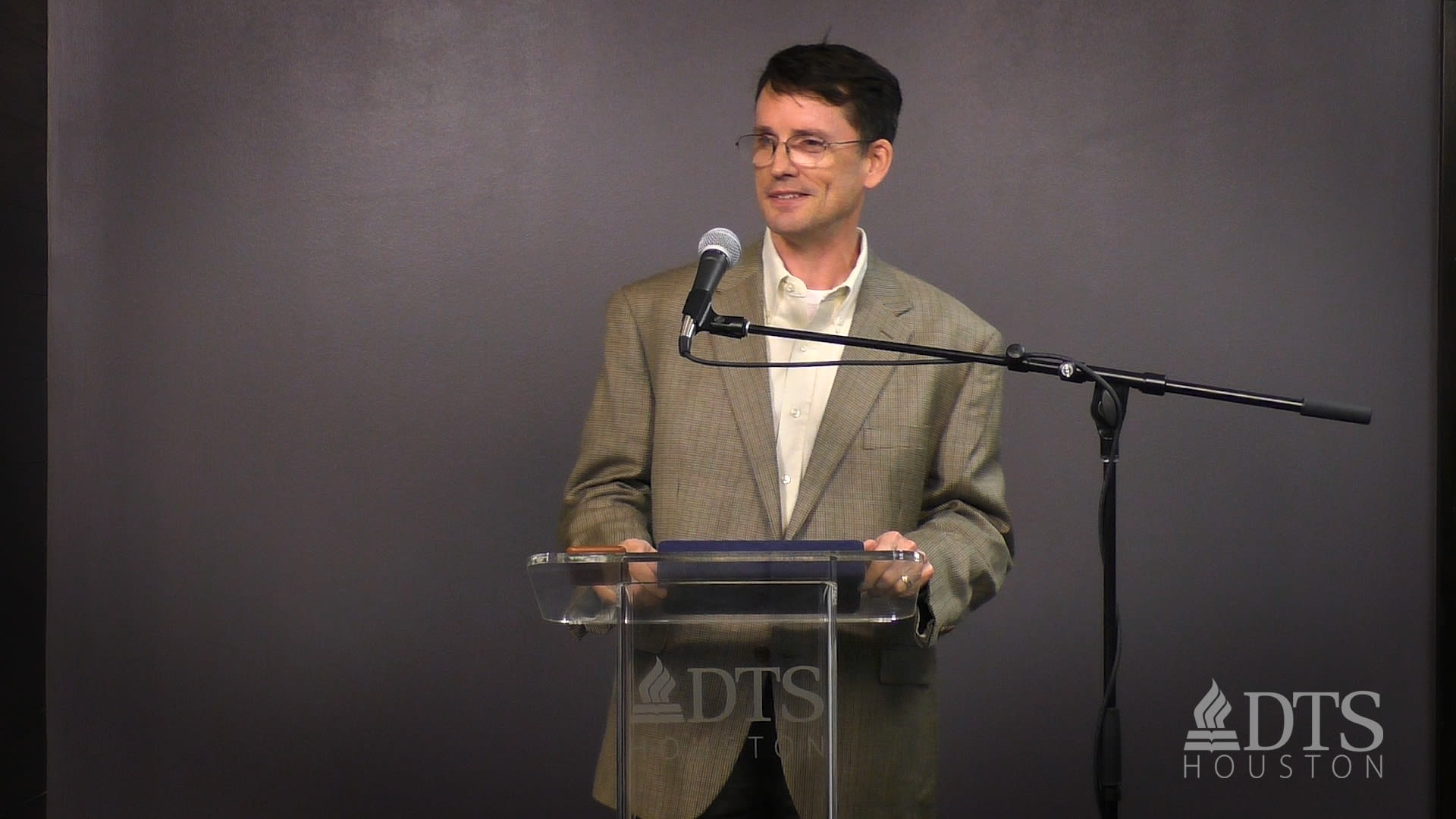 man standing at podium speaking at DTS Chapel