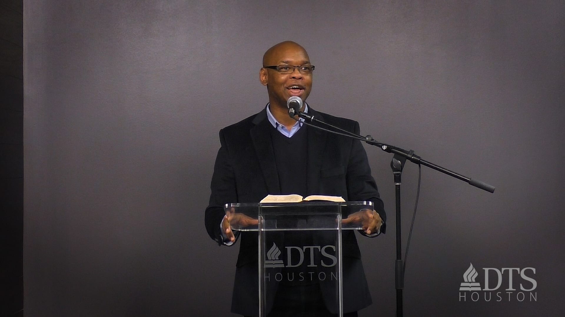 man standing at podium speaking at DTS Chapel