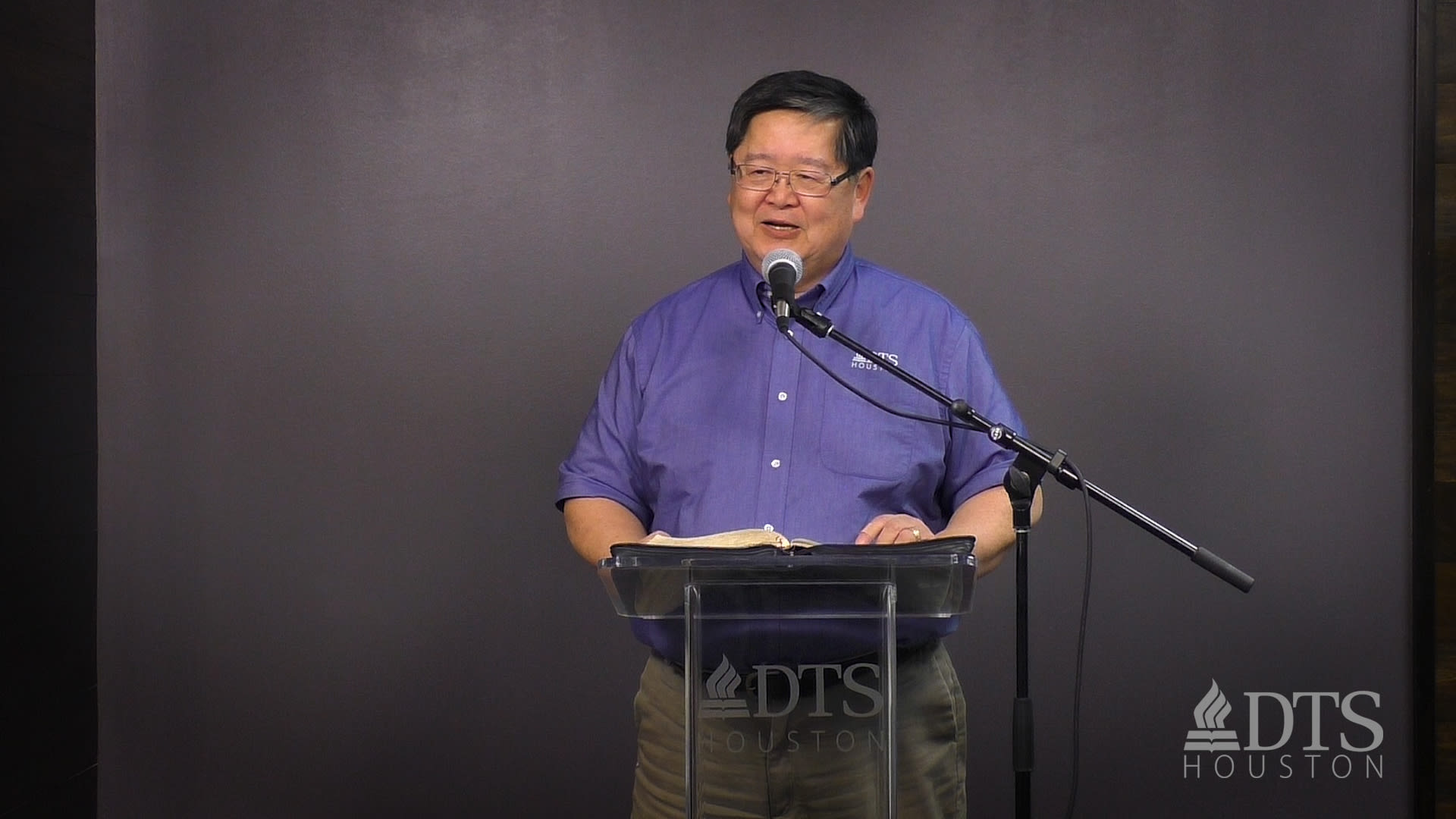 man standing at podium speaking at DTS Chapel