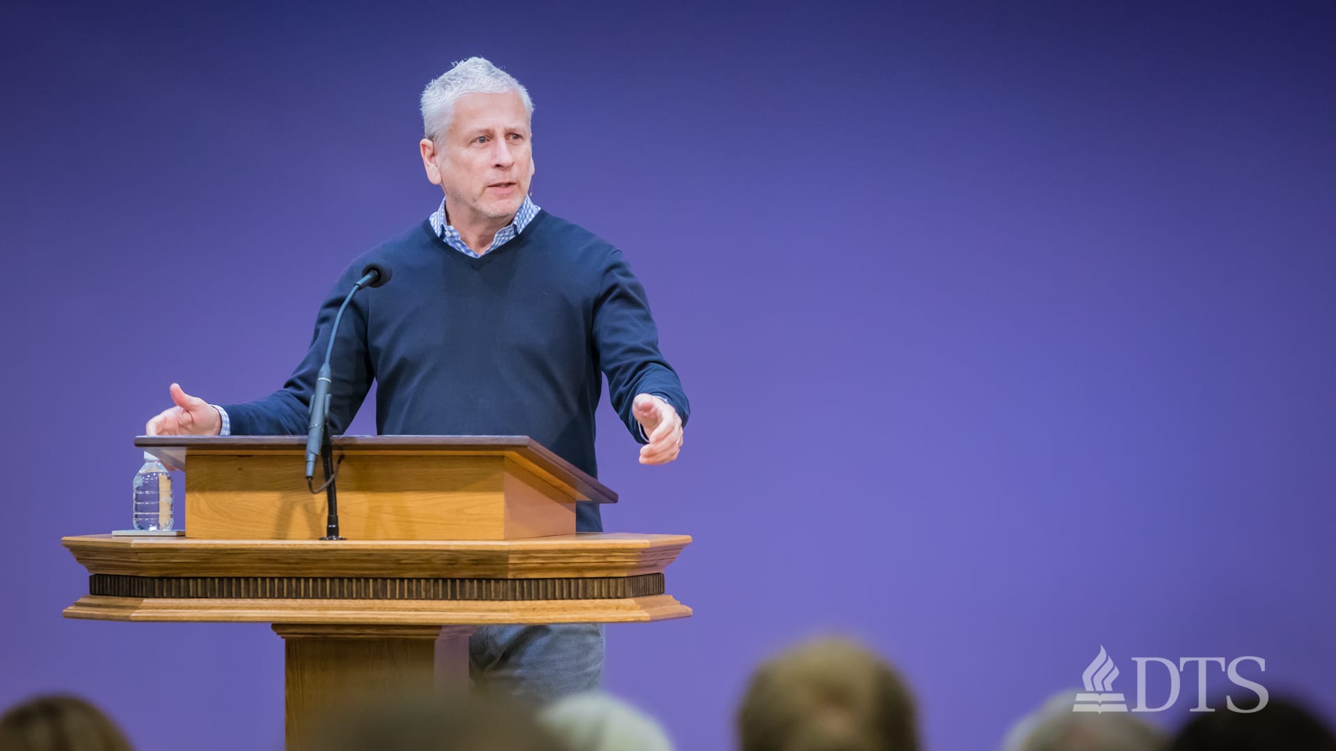 Louie Giglio standing at podium speaking at DTS Chapel