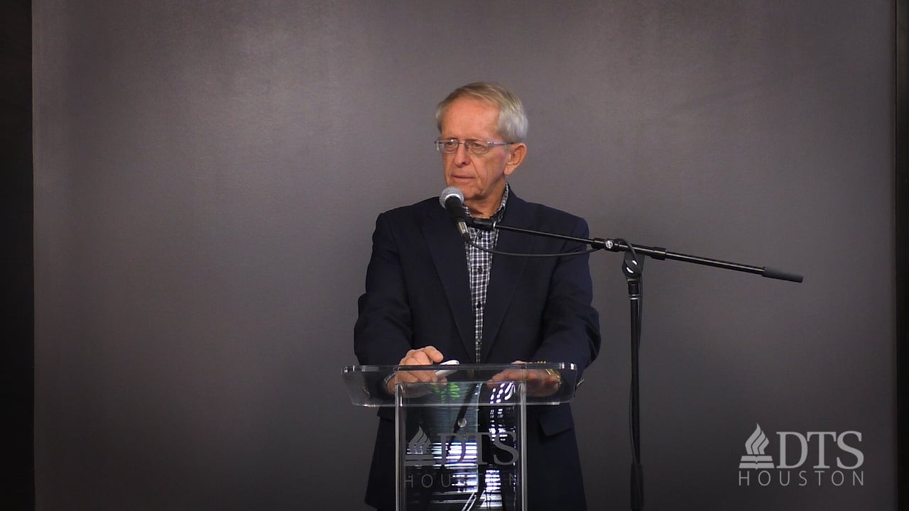 Dr. John Hannah standing at podium speaking at DTS Chapel