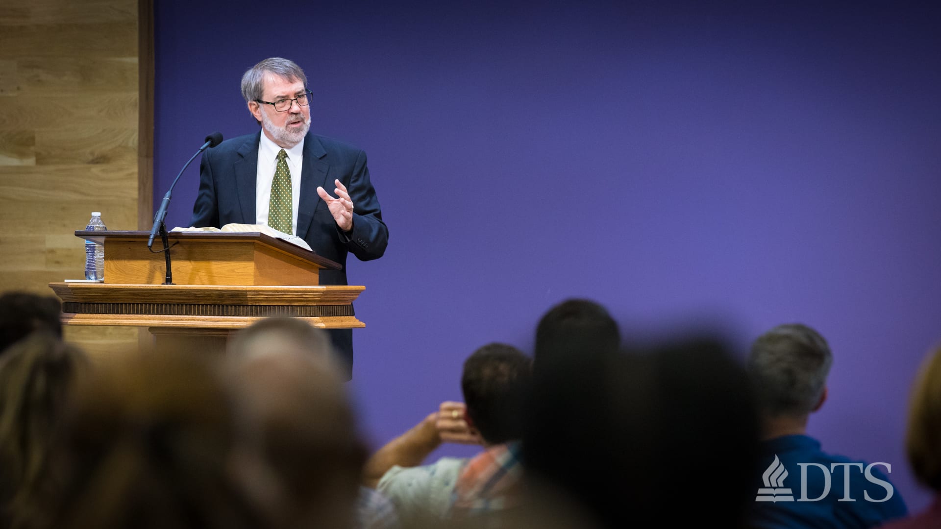man standing at podium speaking at DTS Chapel