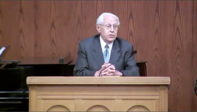 man standing at podium speaking at DTS Chapel