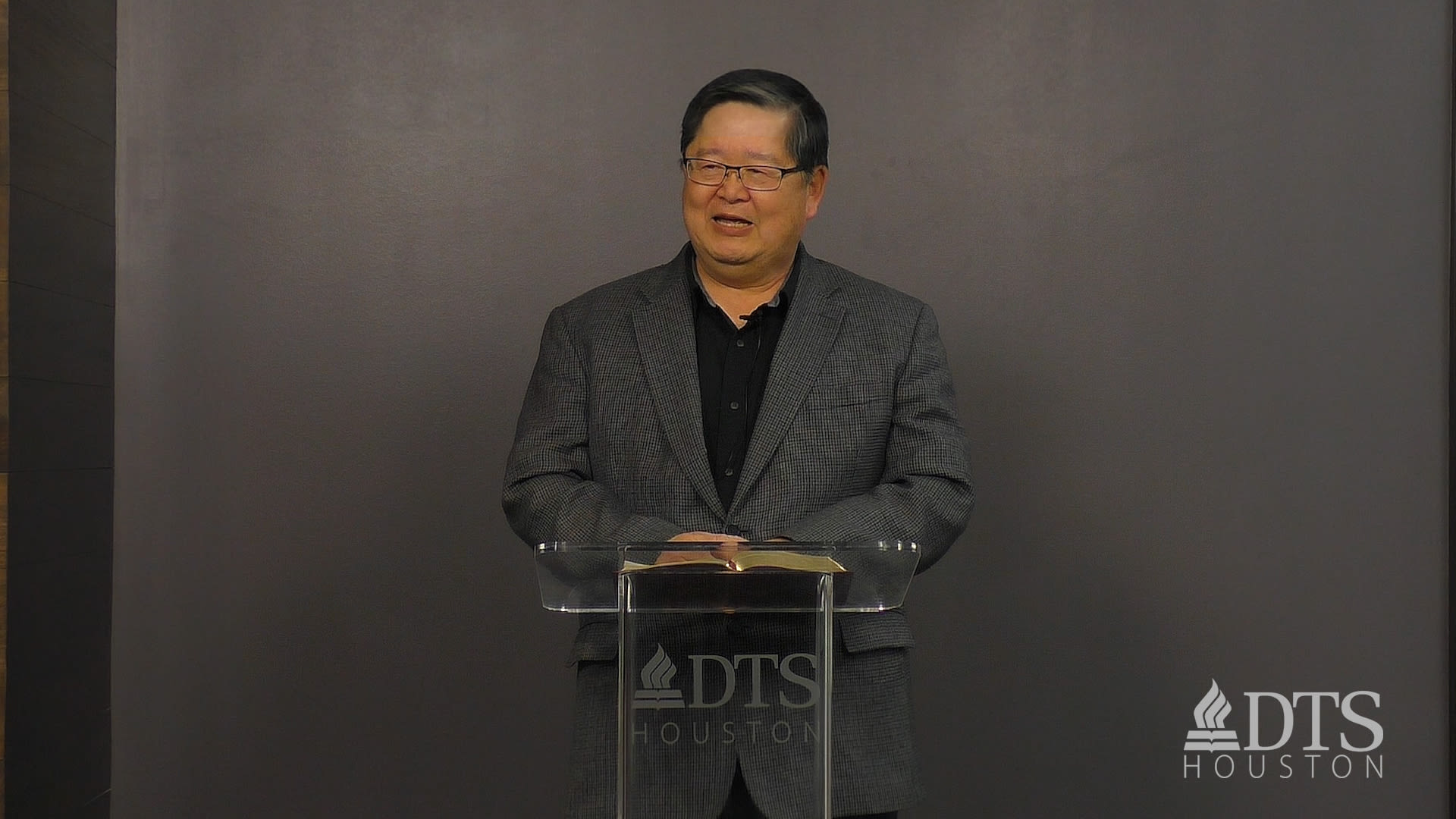 man standing at podium speaking at DTS Chapel