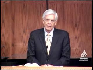 man standing at podium speaking at DTS Chapel