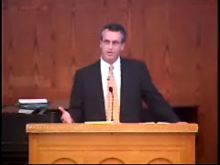 man standing at podium speaking at DTS Chapel