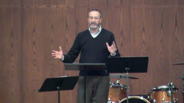 man standing at podium speaking at DTS Chapel