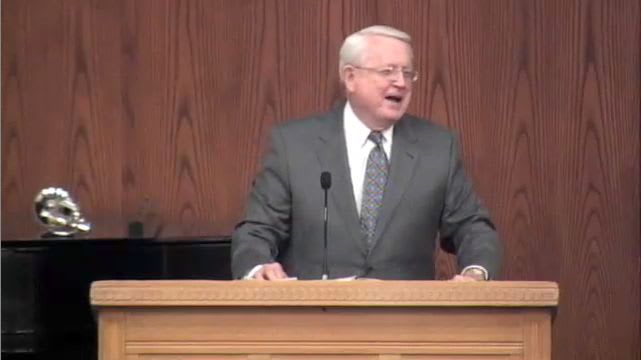 Dr. Chuck Swindoll standing at podium speaking at DTS Chapel